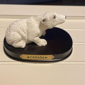 Canada souvenir polar bear on wooden base. 4”
